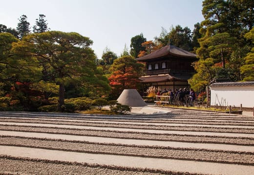 The raked sand garden and sand cone of Ginkaku-ji with autumn colours