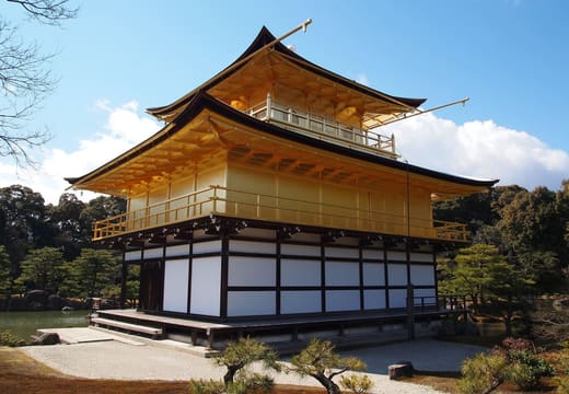 The Golden Pavilion of Kinkaku-ji seen from the side, with its white ground floor and gilded upper storeys