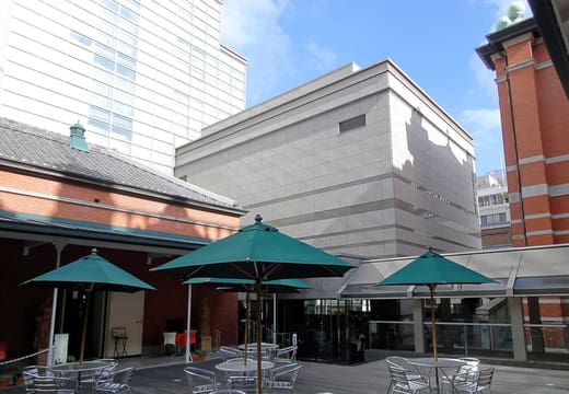 The courtyard of the Museum of Kyoto beside its red brick annex on Sanjo-dori