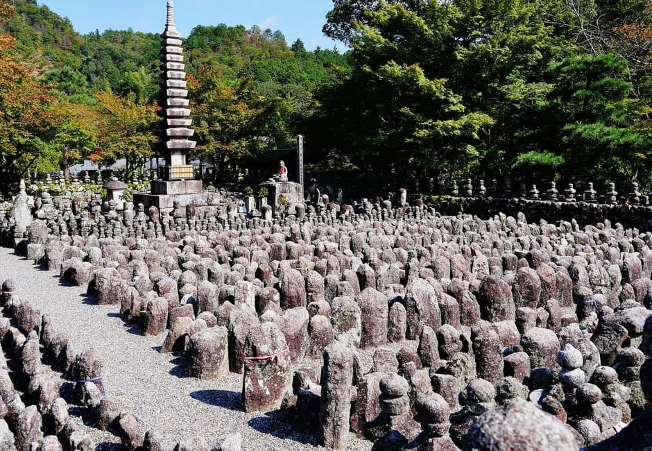 Rows of small stone Buddhas and a stone pagoda at Adashino Nenbutsu-ji in Sagano, Kyoto