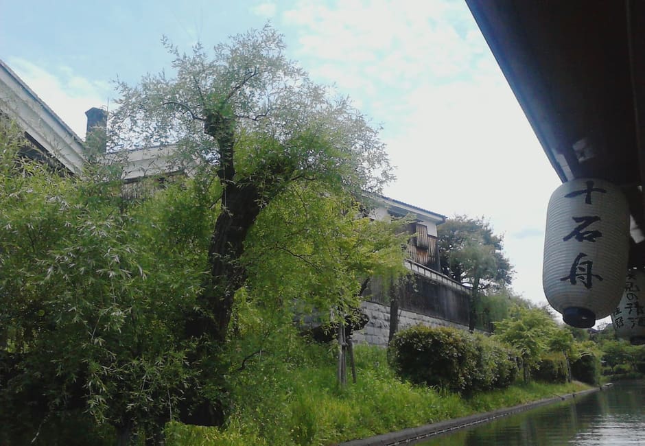 Willows and sake warehouses along the Horikawa canal in Fushimi