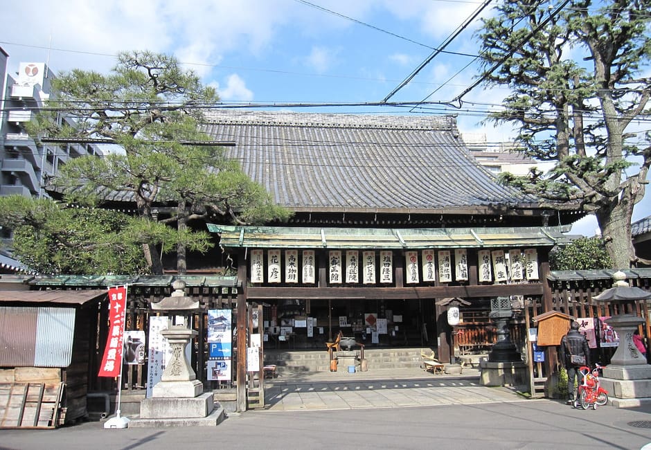 The main hall of Inaba-do, hung with paper lanterns, framed by pine trees in its small courtyard