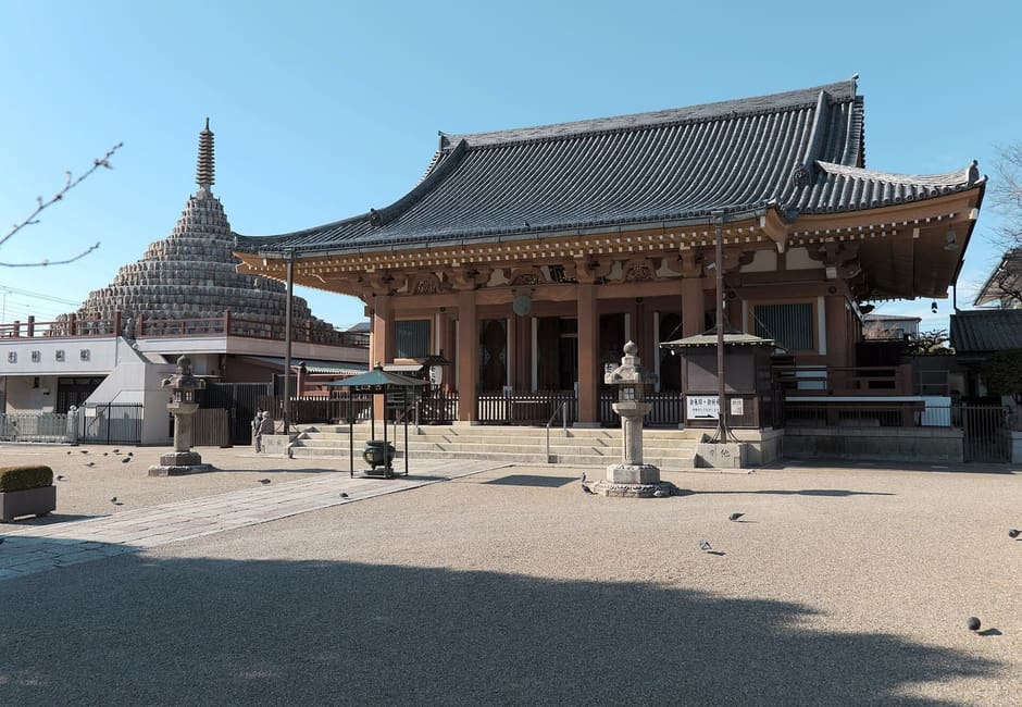 The main hall of Mibu-dera with its stone Buddha pagoda behind, Kyoto