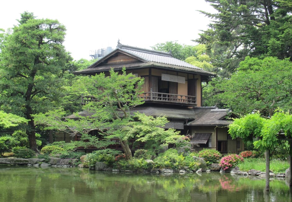 The two storey Shusuitei tea pavilion among pines on the bank of the Kujo pond in Kyoto Gyoen
